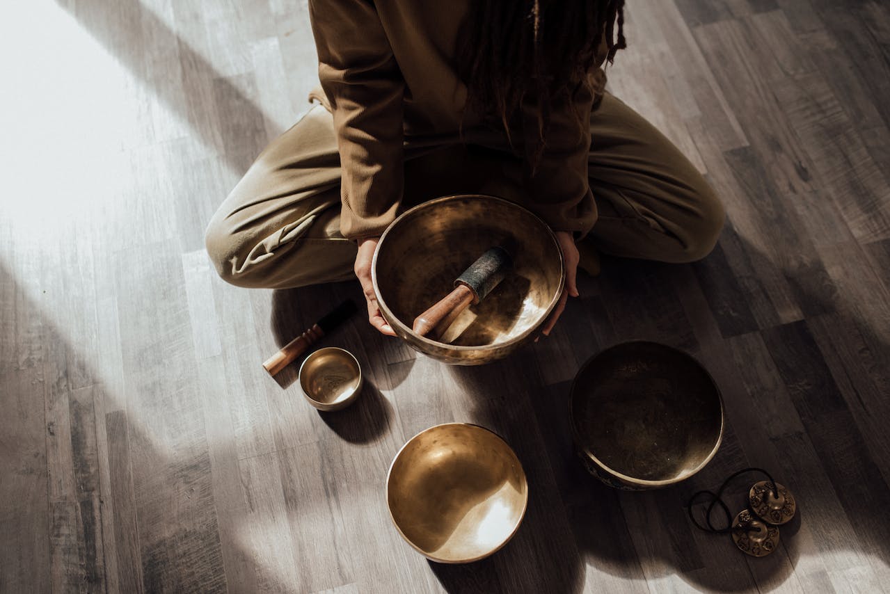 A Person Holding a Tibetan Singing Bowl